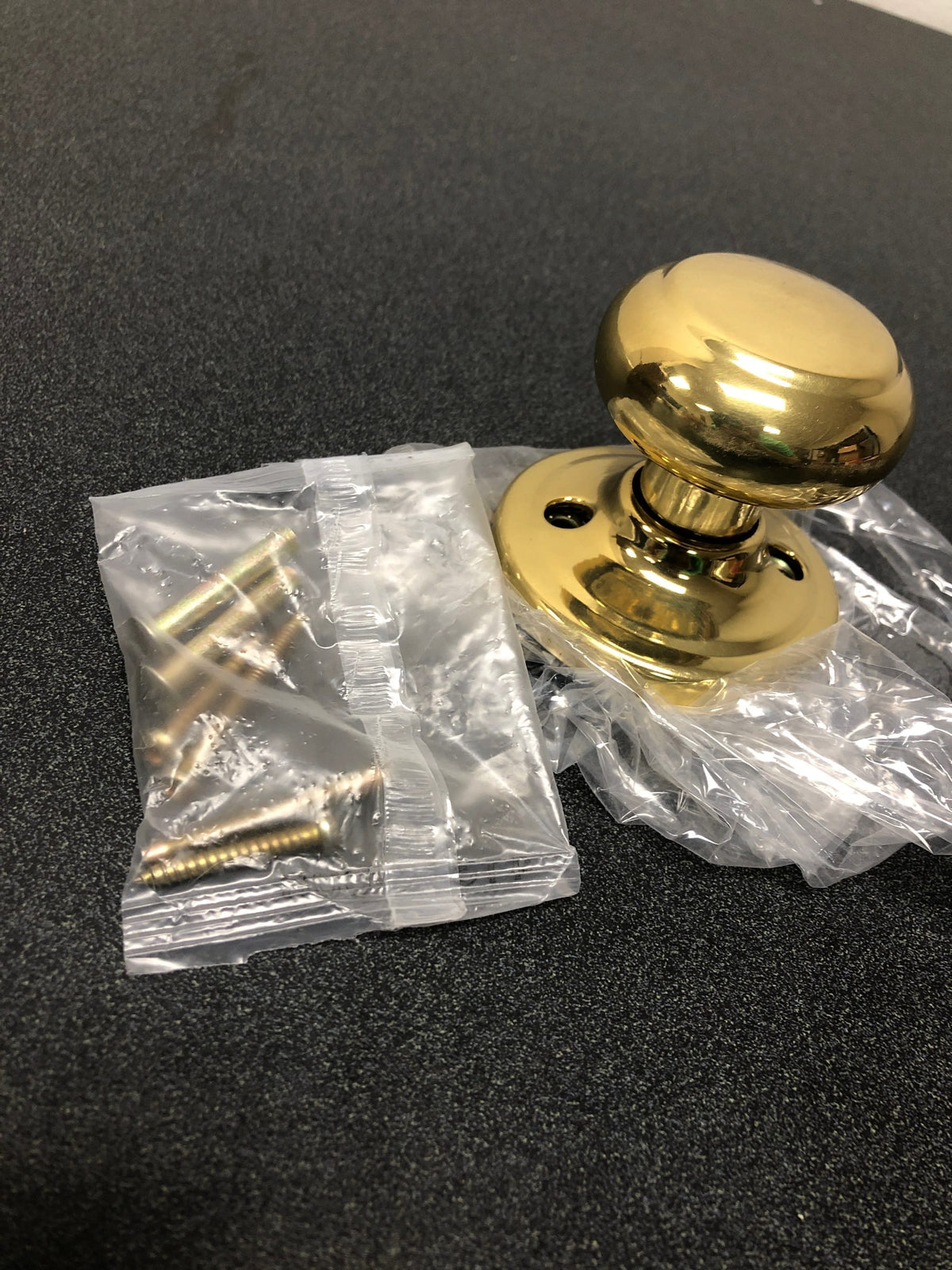 Weiser Lock GA12T3 Troy Single Dummy Door Knob from the Welcome Home Series - Polished Brass