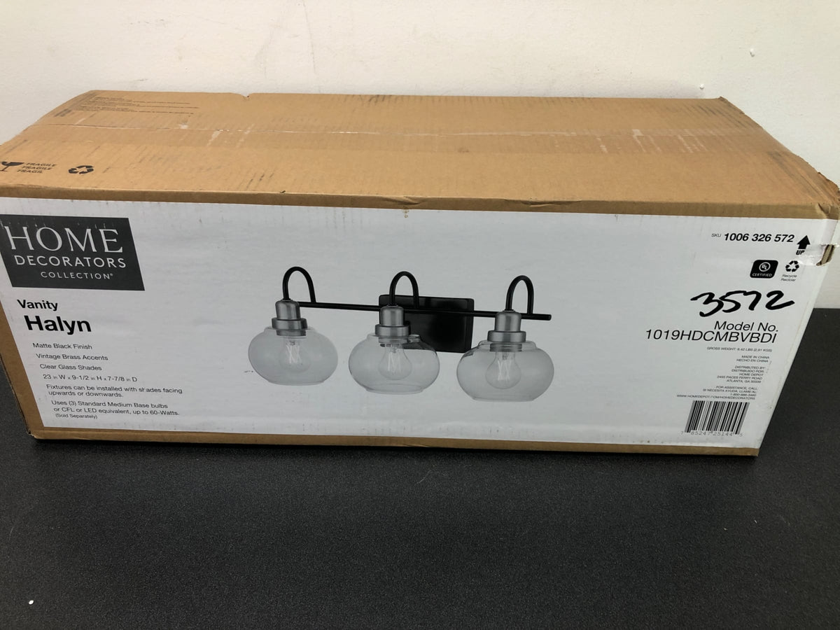 Home decorators collection 1019HDCMBVBDI Halyn 23 in. 3-Light Matte Black with Vintage Brass Bathroom Vanity Light Accents and Clear Glass Shades