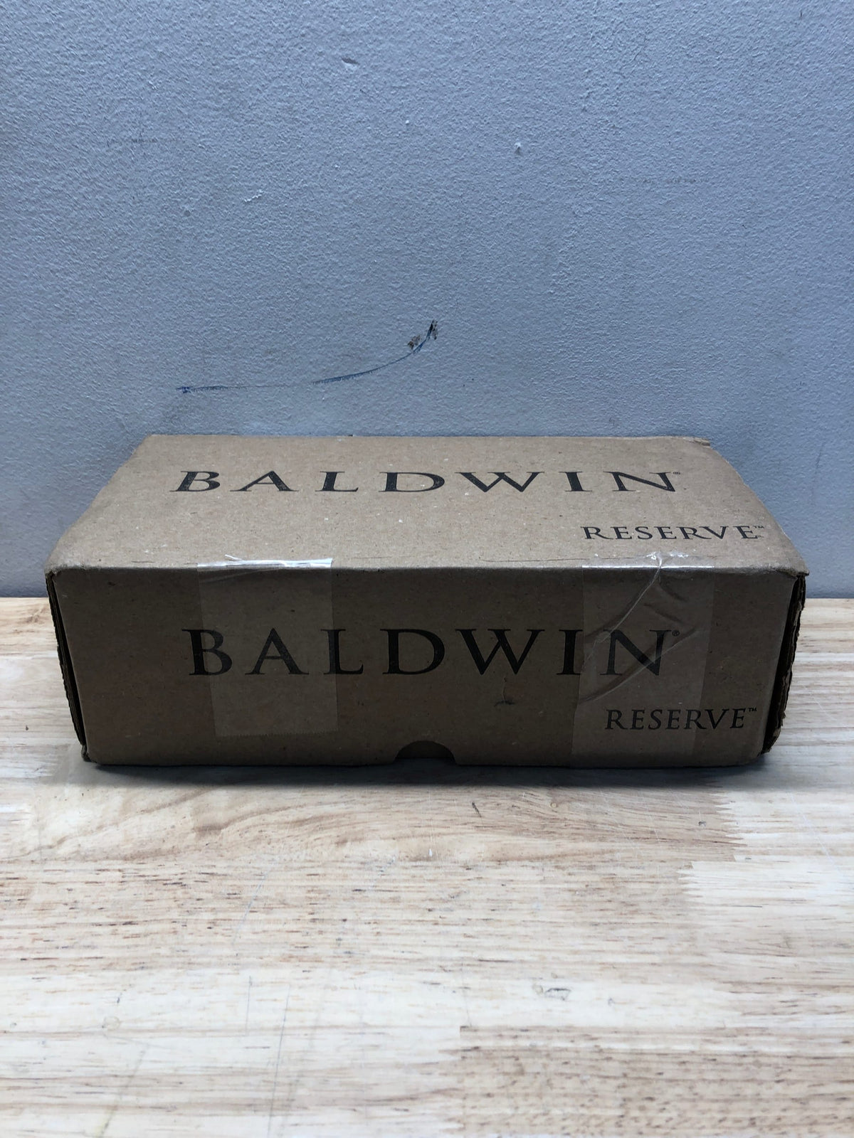 Baldwin FDSQUCSR044 Square Non-Turning Two-Sided Through-Door Dummy Door Lever Set with Square Rosette from the Reserve Collection - Satin Brass