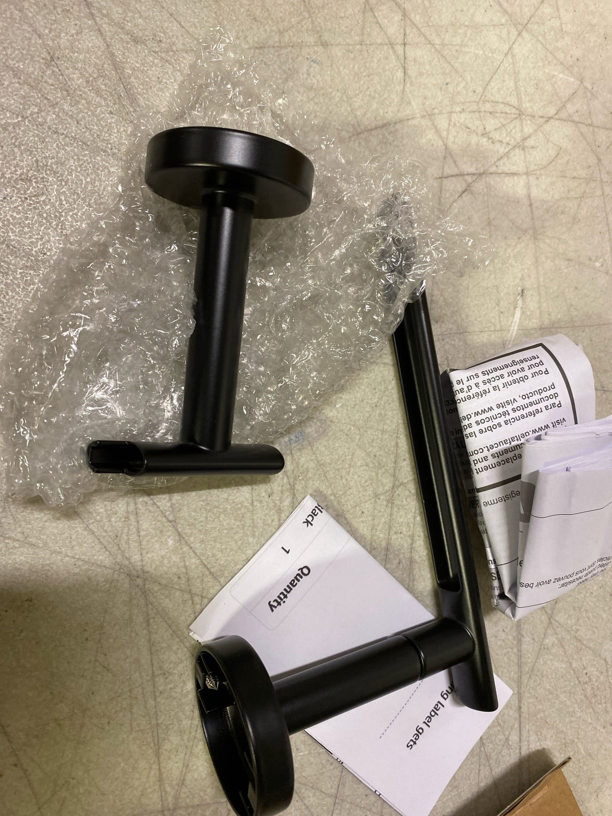 Delta 74250-BL Altado Wall Mounted Pivoting Toilet Paper Holder - Matte Black