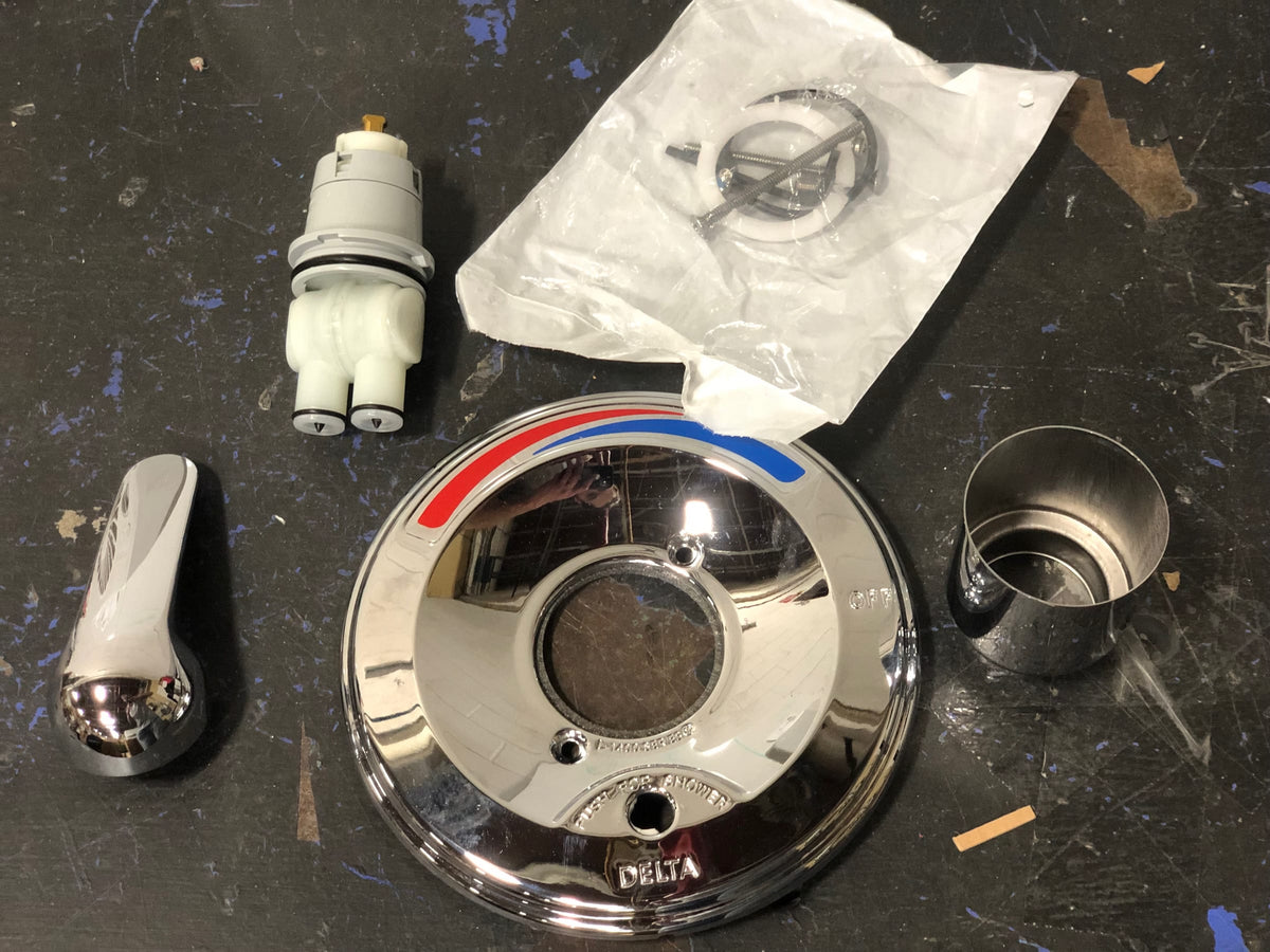 Delta T13391 Single Handle Shower Valve Trim with Push Button Diverter and Metal Lever Handle from the Commercial Series - Chrome