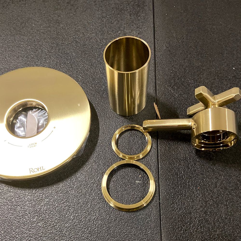 Polished brass shower trim and handle parts from Zokos inventory