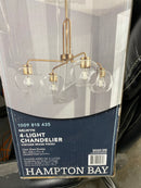 Hampton bay 1051HBVBDI Nelwyn 25 in. 4-Light Vintage Brass Chandelier with Clear Glass Globe Shades