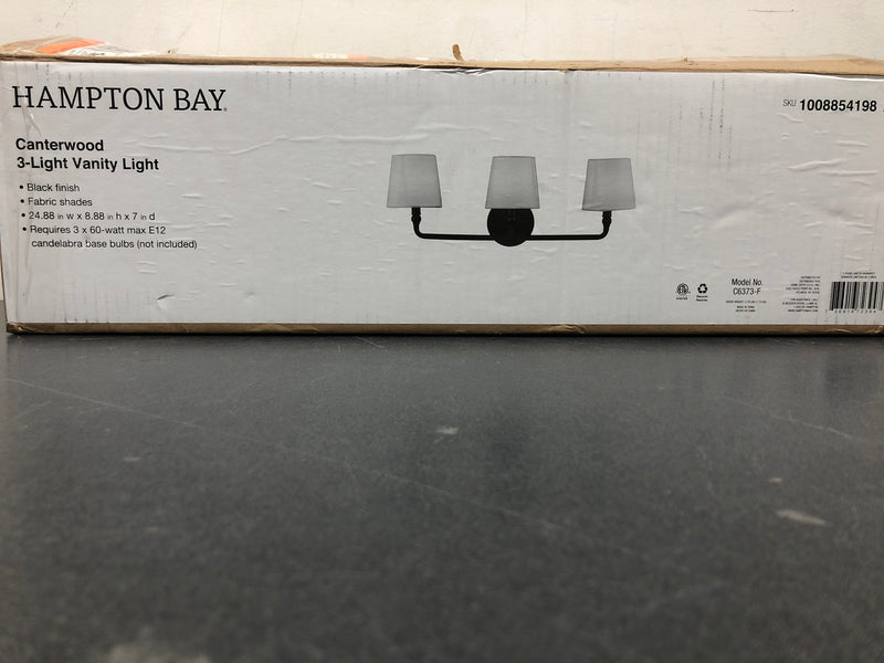 Hampton bay C6373-F Canterwood 24.88 in. 3-Light Black Bathroom Vanity Light Fixture with Tapered Fabric Shades