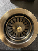 Signature Hardware 483693 4-1/2" Garbage Disposal Flange with Stopper for Sinks up to 5/8" Thick - Aged Brass