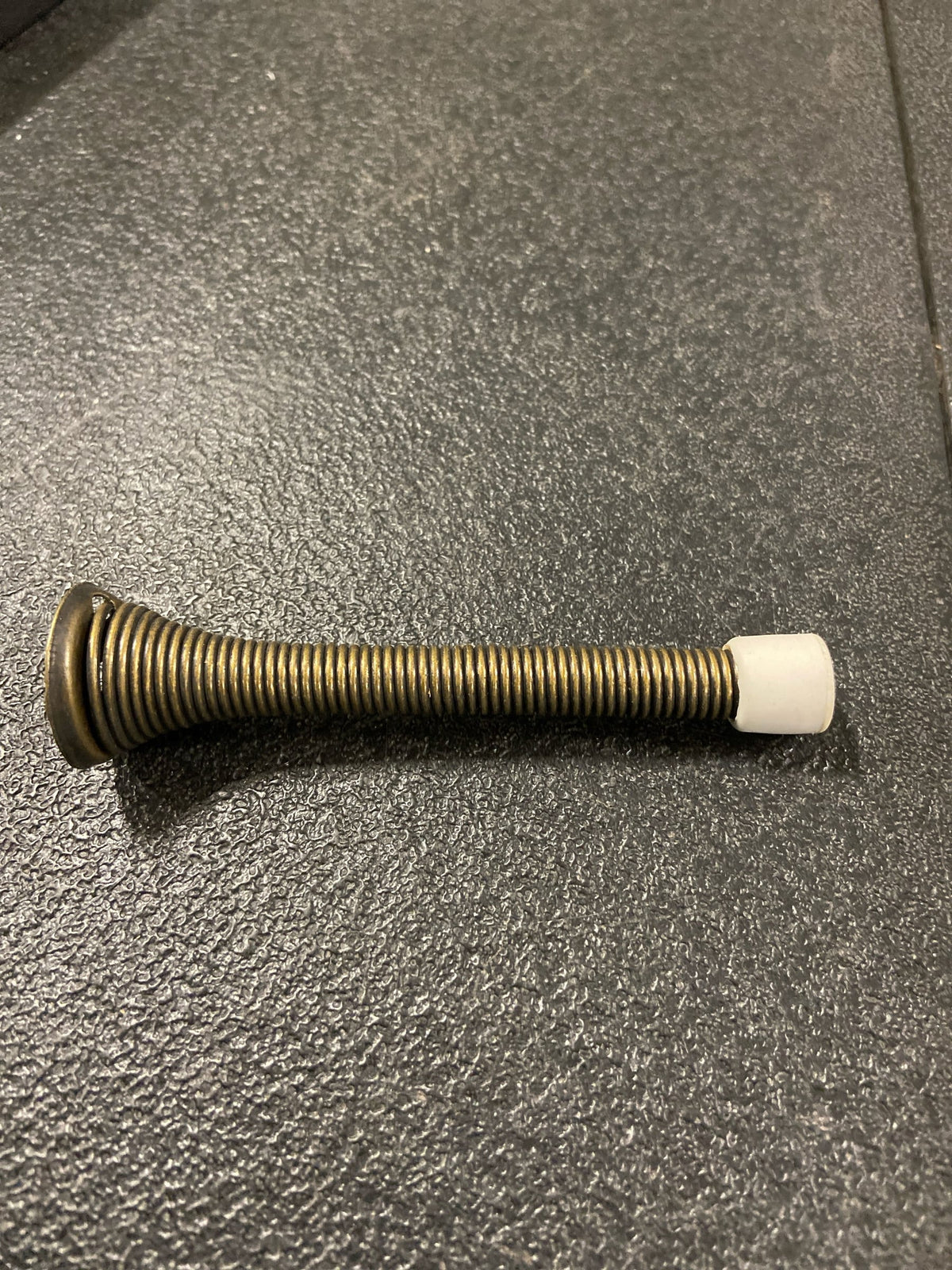 Deltana SDS375U5 Steel 3-3/4" Traditional Spring Style Baseboard Door Bumper / Door Stopper - Antique Brass