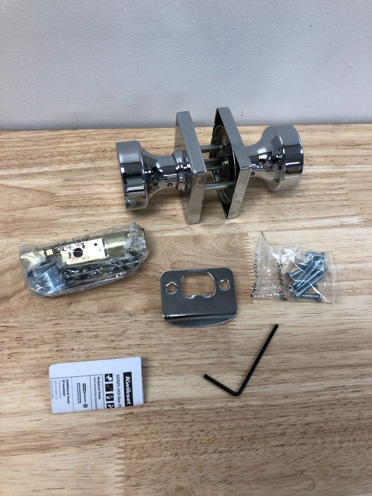Kwikset Pismo Passage Door Knob Set with Square Rose - Polished Chrome