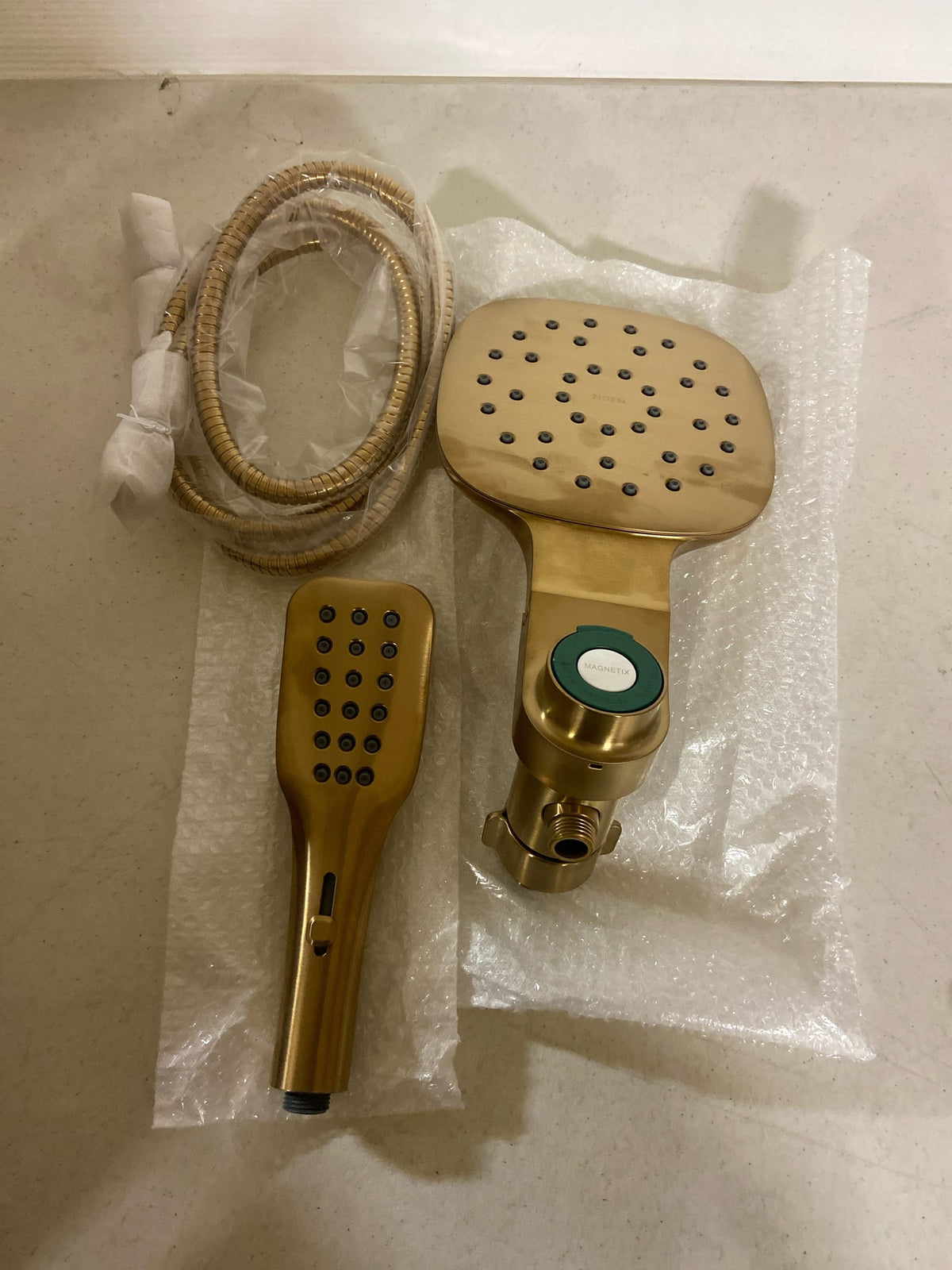 Moen 220C5EPBG Verso 1.75 GPM Multi Function Shower Head with Hand Shower, Infiniti Dial, and Magnetix Technology - Brushed Gold