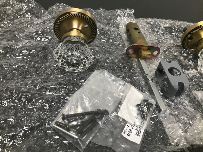 Nostalgic Warehouse 702127 Crystal Solid Brass Privacy Door Knob Set with Rope Rose and 2-3/8" Backset - Antique Brass