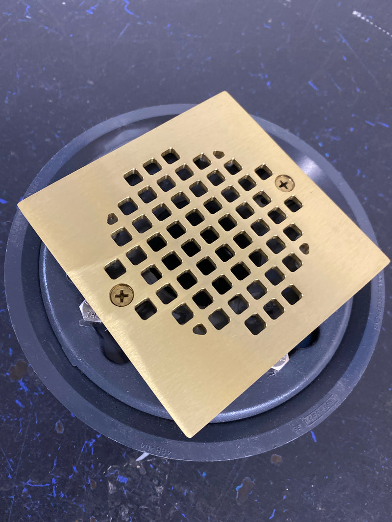 Jones stephens D50135 2 in. x 3 in. PVC Shower Drain/Floor Drain w/4 in. Polished Brass Cast Square Strainer-Fits Over 2 in. Sch. 40 DWV Pipe