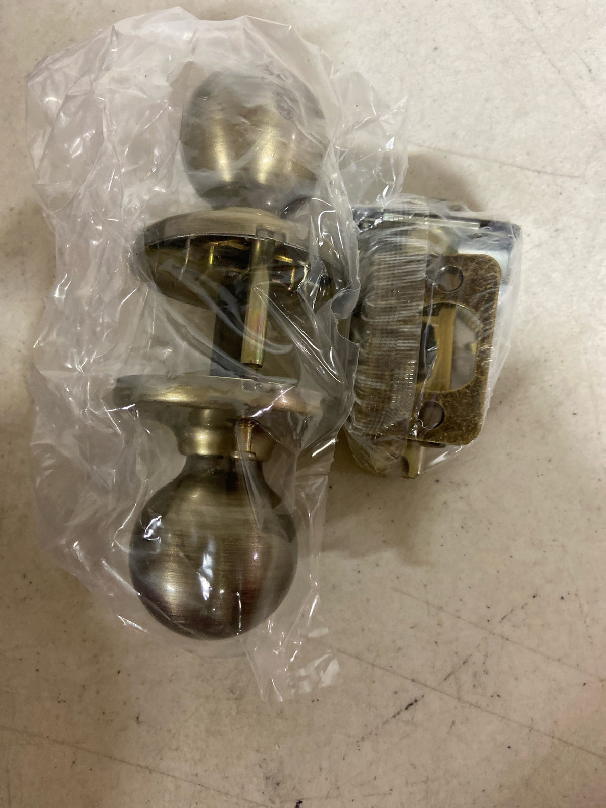 Kwikset 200P-5 Polo Passage Door Knob Set with Round Rose - Antique Brass