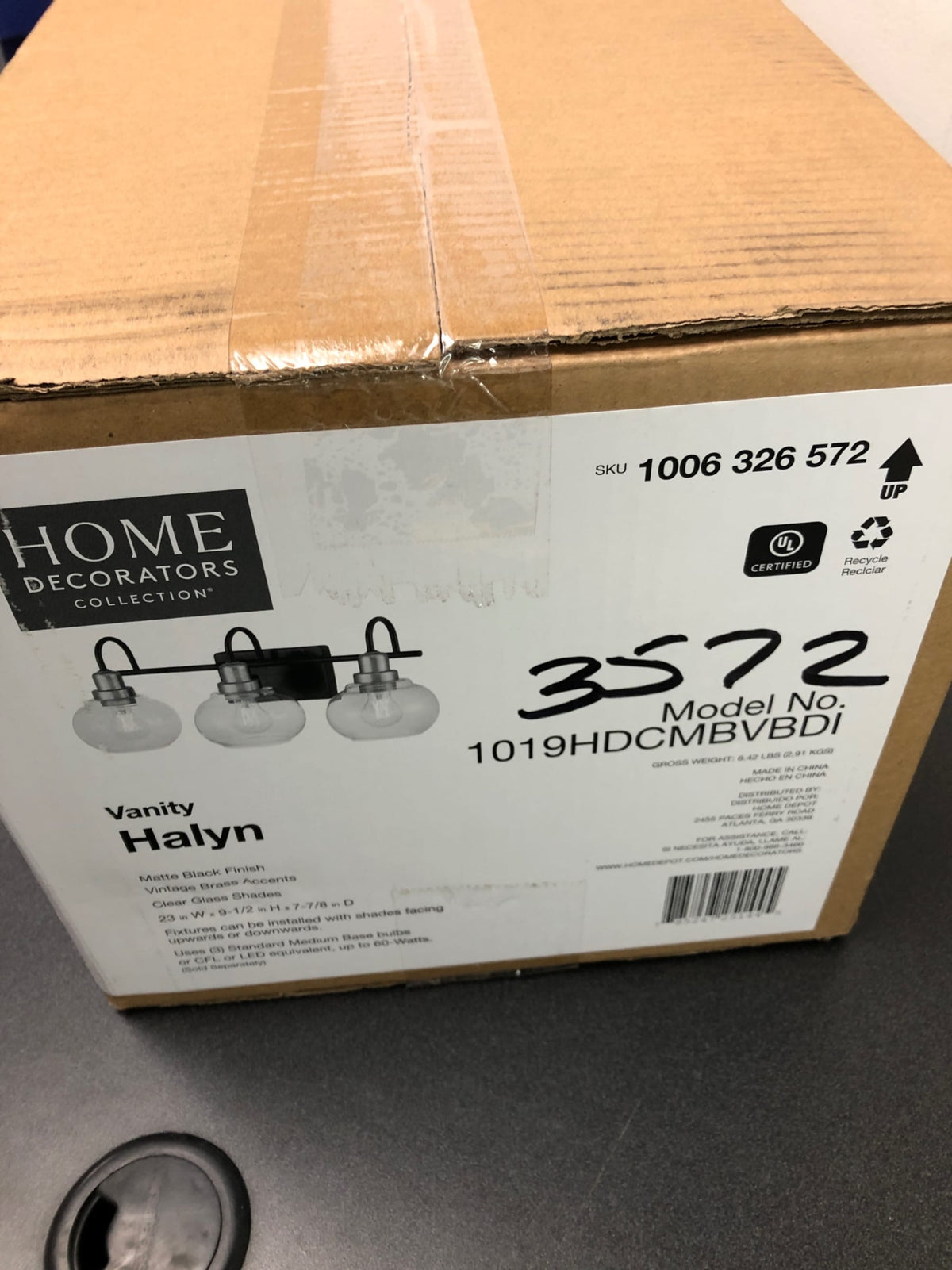 Home decorators collection 1019HDCMBVBDI Halyn 23 in. 3-Light Matte Black with Vintage Brass Bathroom Vanity Light Accents and Clear Glass Shades