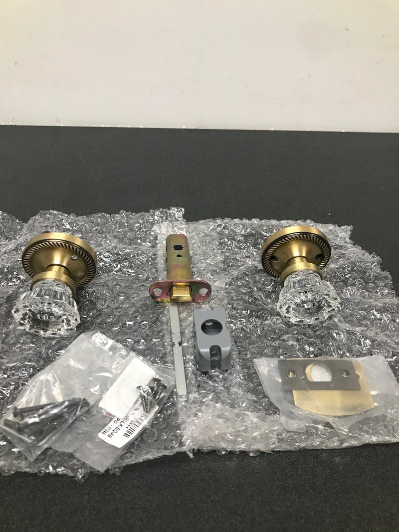 Nostalgic Warehouse 702127 Crystal Solid Brass Privacy Door Knob Set with Rope Rose and 2-3/8" Backset - Antique Brass