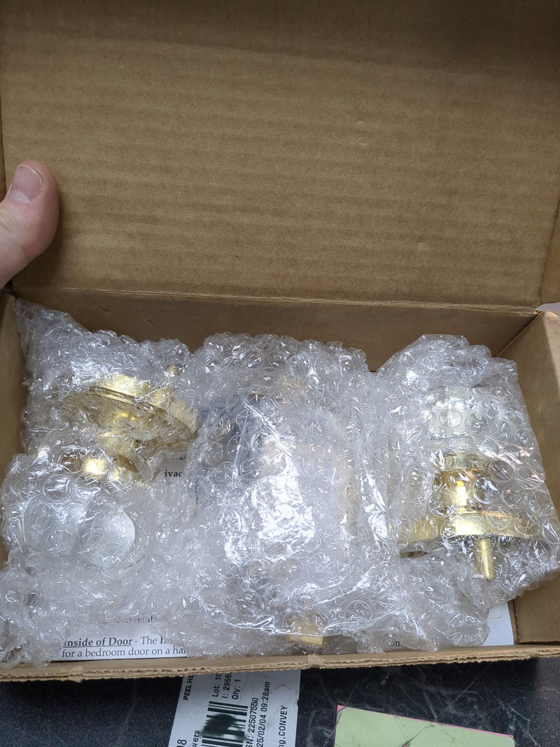 Nostalgic Warehouse 709723 Waldorf Lead Crystal Passage Door Knob Set with Solid Brass Round Rope Trim Backplate and 2-3/4" Backset - Polished Brass