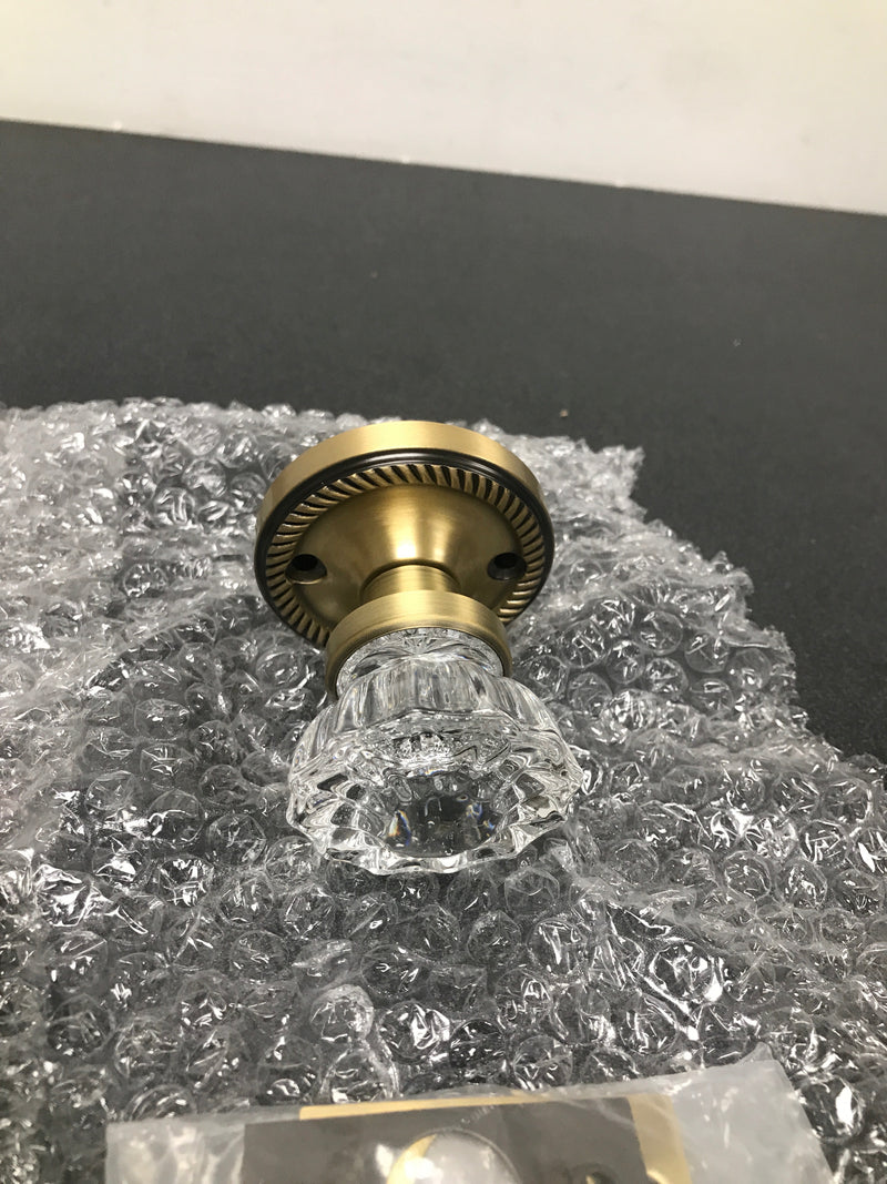 Nostalgic Warehouse 702127 Crystal Solid Brass Privacy Door Knob Set with Rope Rose and 2-3/8" Backset - Antique Brass