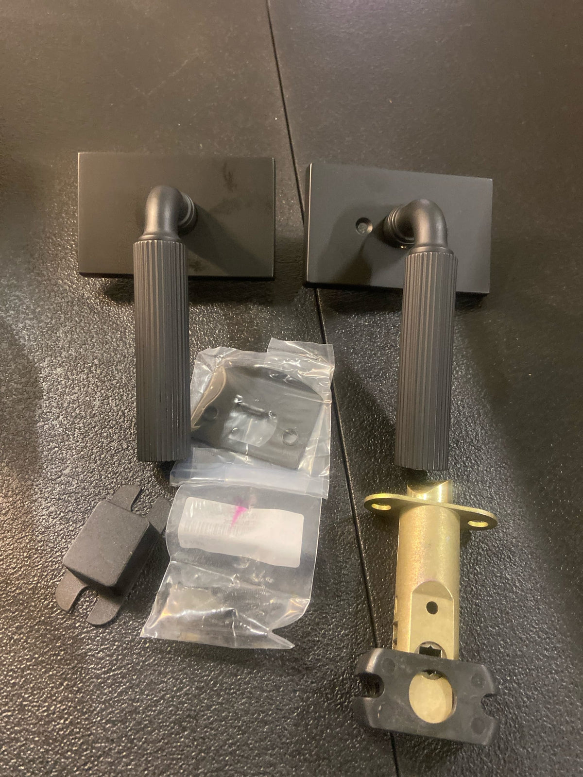 Emtek 510SKUS19 Straight Knurled Passage Door Lever Set from the SELECT Brass Collection - Flat Black Modern Rectangular rosette R-Bar Stem